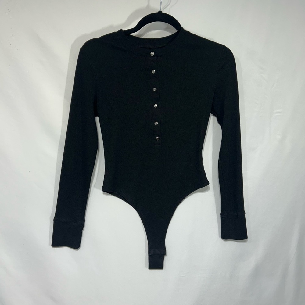 Black Long Sleeve Henley Bodysuit with functioning snaps. Size Medium.